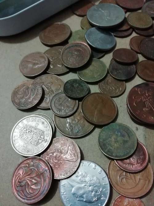 Toffee tin with mixed 120 international coins