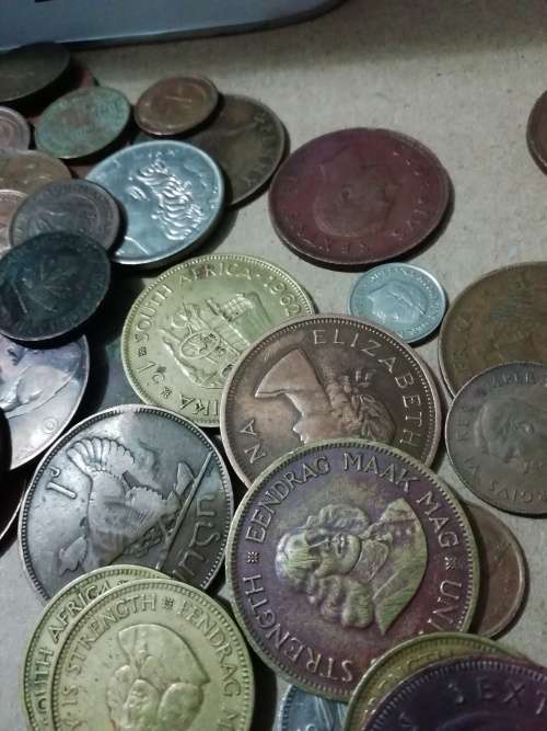 Toffee tin with mixed 120 international coins