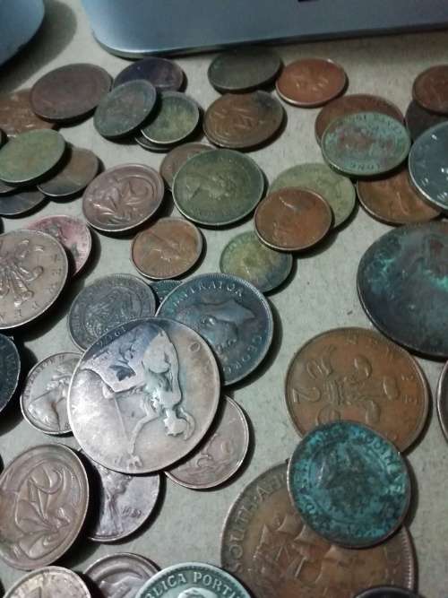 Toffee tin with mixed 120 international coins