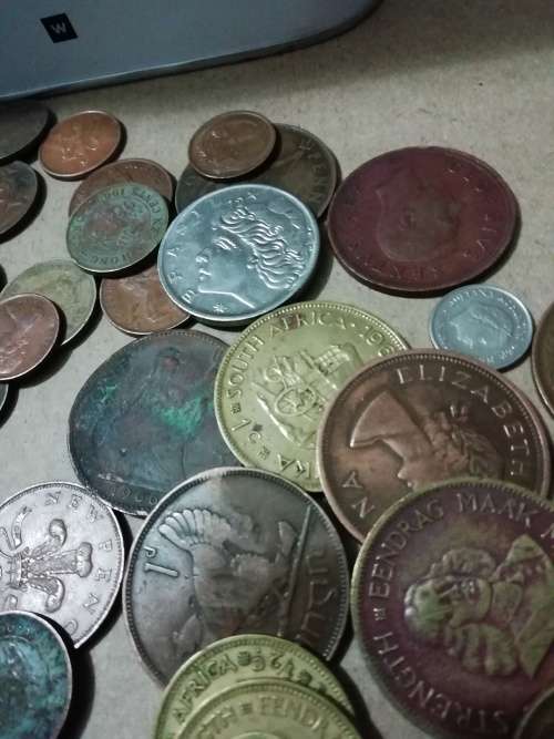 Toffee tin with mixed 120 international coins