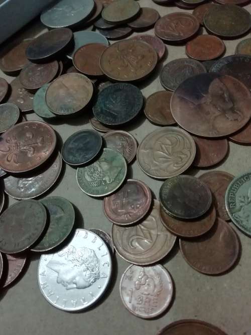 Toffee tin with mixed 120 international coins