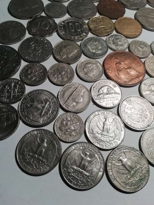 55 Mixed International coins. One bid for the lot