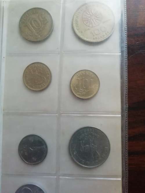 Bickels Coin Album with sleeves and 58 mixed coins.