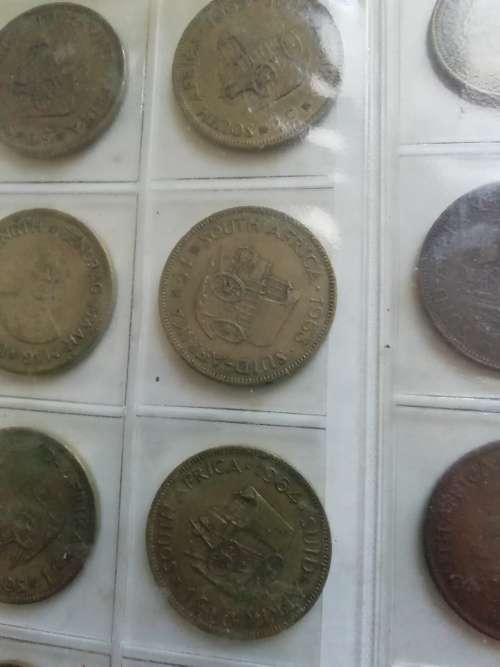 Bickels Coin Album with sleeves and 58 mixed coins.