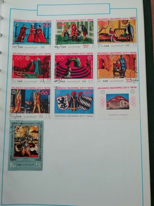 Stamp album, full of hinged stamps.