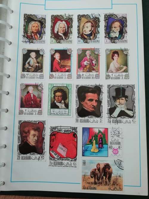 Stamp album, full of hinged stamps.