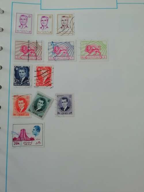 Stamp album, full of hinged stamps.