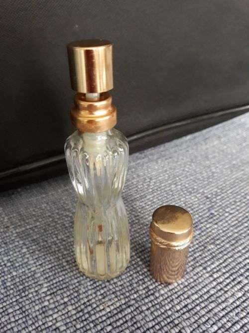 AN EMPTY BOTTLE OF YOUTH DEW BY ESTÉE LAUDER