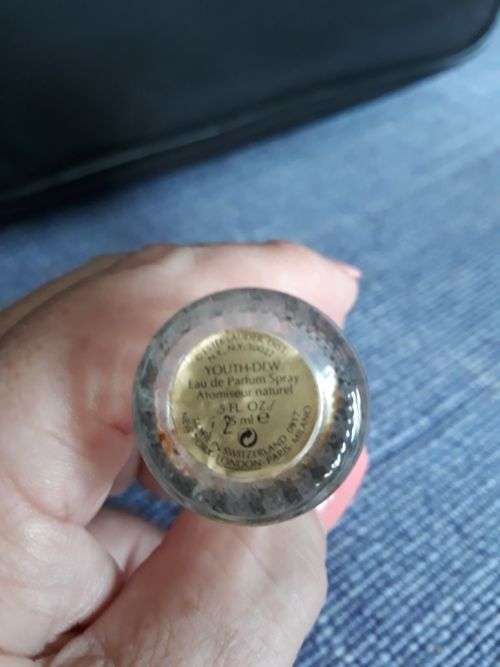 AN EMPTY BOTTLE OF YOUTH DEW BY ESTÉE LAUDER