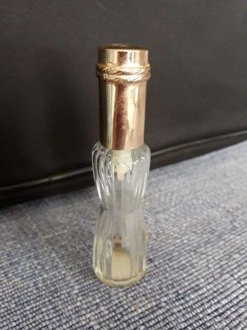 AN EMPTY BOTTLE OF YOUTH DEW BY ESTÉE LAUDER