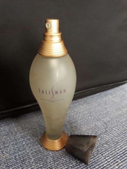 THIS SEXY SLINKY SHAPED BOTTLE BY BALENCIAGA, PARIS, IS A MUST FOR YOUR COLLECTION. MAKE A BID!