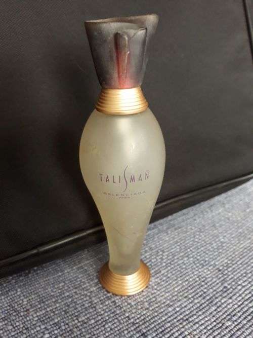 THIS SEXY SLINKY SHAPED BOTTLE BY BALENCIAGA, PARIS, IS A MUST FOR YOUR COLLECTION. MAKE A BID!