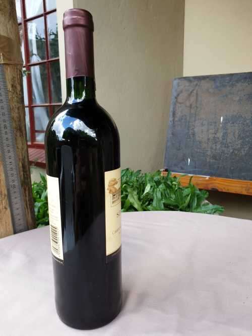 AN OLD BOTTLE OF SIMONSVLEI CABERNET SAUVIGNON - MERLOT