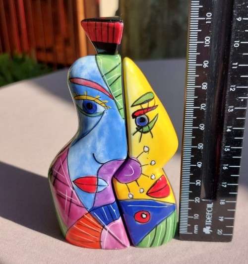 VERY CUTE HUGGING HIM AND HER SALT AND PEPPER SHAKERS WITH BRIGHT AFRICAN COLOURS