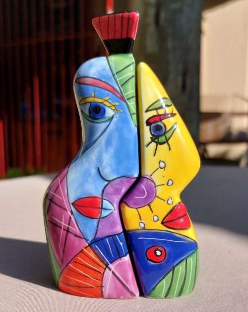 VERY CUTE HUGGING HIM AND HER SALT AND PEPPER SHAKERS WITH BRIGHT AFRICAN COLOURS