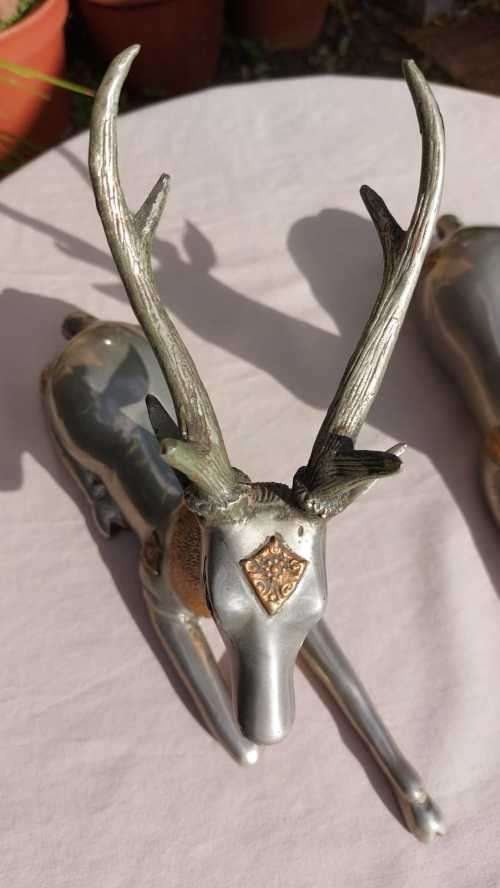 RARE SET OF 2 VINTAGE PEWTER AND BRASS RECLINING STAG REINDEER BOOKENDS