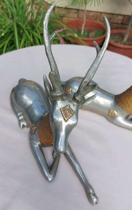 RARE SET OF 2 VINTAGE PEWTER AND BRASS RECLINING STAG REINDEER BOOKENDS