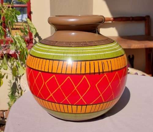 A LARGE COLOURFULL ETHNIC TRIBAL BELLY CERAMIC BASE