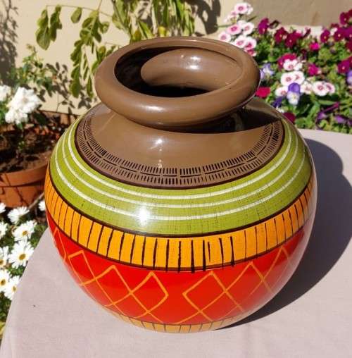 A LARGE COLOURFULL ETHNIC TRIBAL BELLY CERAMIC BASE