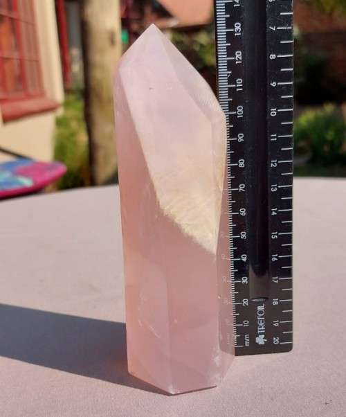 A 400G ROSE QUARTZ OBELISK WITH A 6 FACETTED POINT  CUT AND POLISHED IN ZAMBIA