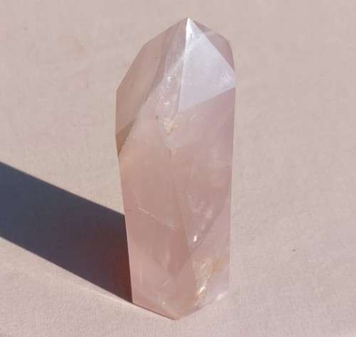 A 400G ROSE QUARTZ OBELISK WITH A 6 FACETTED POINT  CUT AND POLISHED IN ZAMBIA