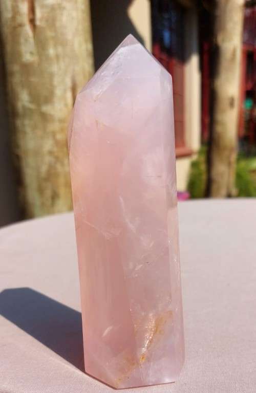 A 400G ROSE QUARTZ OBELISK WITH A 6 FACETTED POINT  CUT AND POLISHED IN ZAMBIA