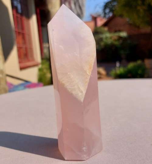 A 400G ROSE QUARTZ OBELISK WITH A 6 FACETTED POINT  CUT AND POLISHED IN ZAMBIA