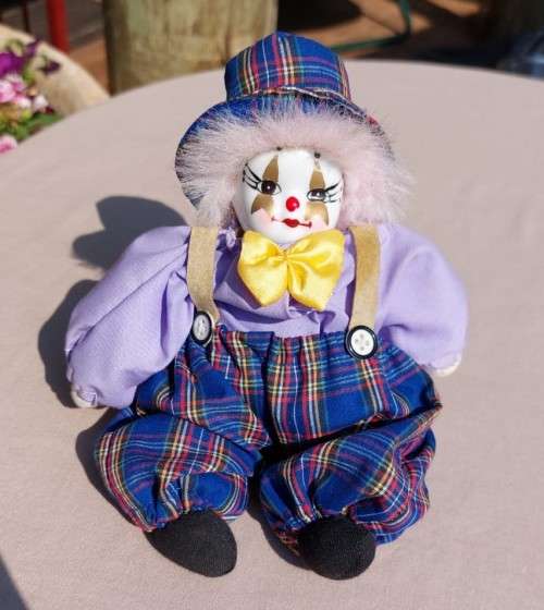 CREEPY CLOWN DOLL WITH PLASTIC FACE AND SAWDUST FILLED BODY