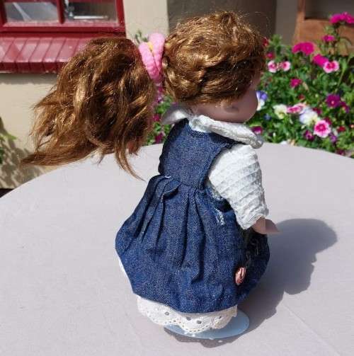 CUTE HIGH QUALITY PORCELAIN DOLL WITH BLUE EYES AND BIG EYELASHES ON STAND