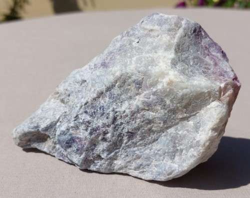 INCREDIBLY BEAUTIFUL RAW ROCK SPECIMEN IN SHADES OF PINK TO DARK PURPLE ON A WHITE QUARTZ OR PECTOLI
