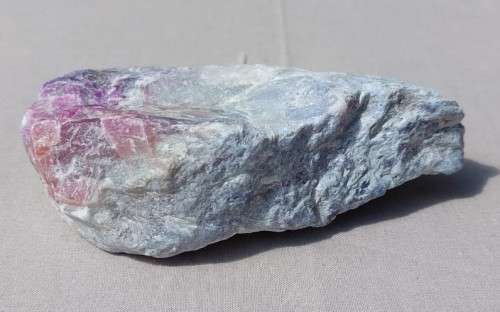 INCREDIBLY BEAUTIFUL RAW ROCK SPECIMEN IN SHADES OF PINK TO DARK PURPLE ON A WHITE QUARTZ OR PECTOLI