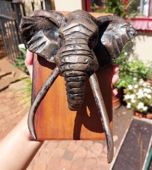 AFRICAN BULL ELEPHANT HENKMAM CLAY SCULPTURE WITH BRONZE COATING ON WOODEN WALL MOUNT