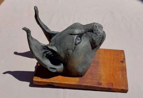 CARACAL (ROOIKAT) HENKMAM CLAY SCULPTURE WITH BRONZE COATING ON WOODEN WALL MOUNT