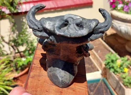 WARTHOG HENKMAM CLAY SCULPTURE WITH BRONZE COATING ON WOODEN WALL MOUNT