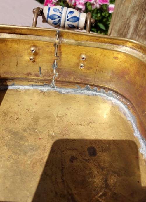 1940S BRASS AND METAL PLANTER WITH DELFT CERAMIC HANDLES AND CLAW FEET
