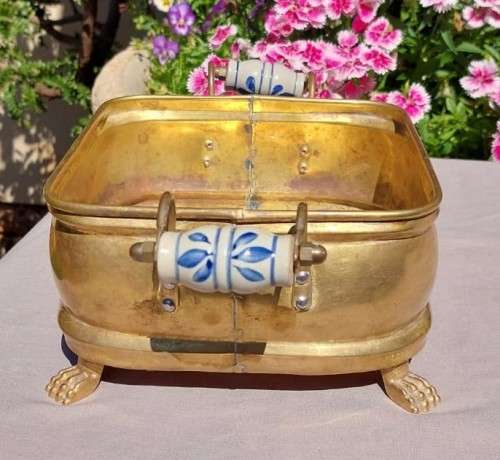 1940S BRASS AND METAL PLANTER WITH DELFT CERAMIC HANDLES AND CLAW FEET