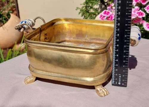 1940S BRASS AND METAL PLANTER WITH DELFT CERAMIC HANDLES AND CLAW FEET