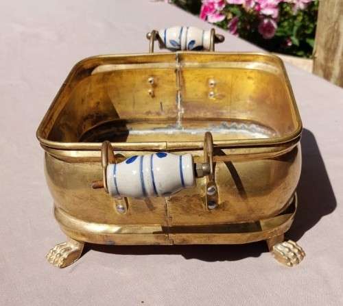 1940S BRASS AND METAL PLANTER WITH DELFT CERAMIC HANDLES AND CLAW FEET
