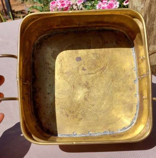 1940S BRASS AND METAL PLANTER WITH DELFT CERAMIC HANDLES AND CLAW FEET