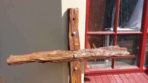 HANDMADE WOODEN CROSS DECORATED WITH NAILS AND VARNISH COATED