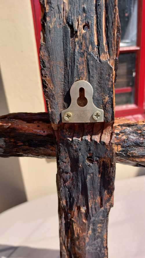 HANDMADE WOODEN CROSS DECORATED WITH NAILS AND VARNISH COATED