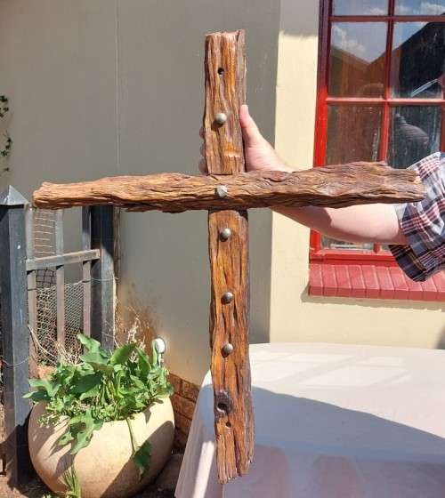 HANDMADE WOODEN CROSS DECORATED WITH NAILS AND VARNISH COATED
