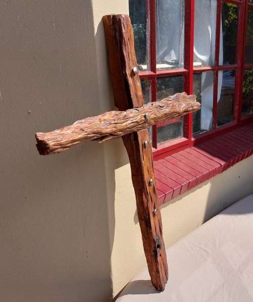 HANDMADE WOODEN CROSS DECORATED WITH NAILS AND VARNISH COATED