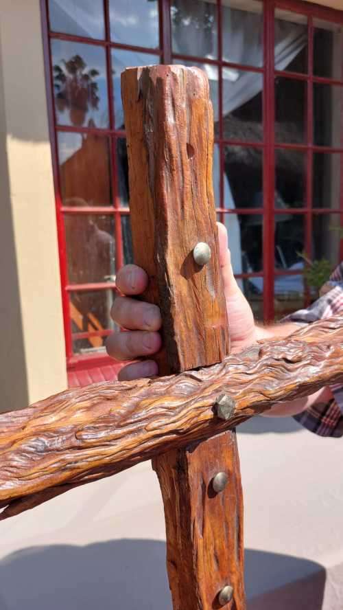 HANDMADE WOODEN CROSS DECORATED WITH NAILS AND VARNISH COATED