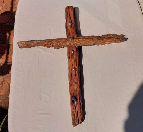 HANDMADE WOODEN CROSS DECORATED WITH NAILS AND VARNISH COATED