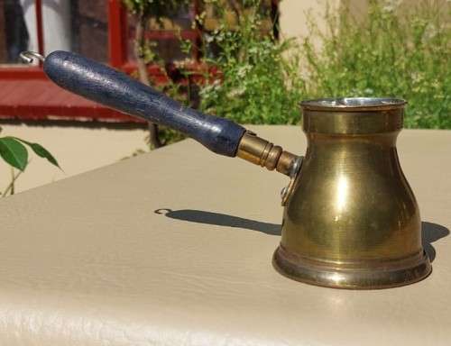 FOUR TURKISH OR GREEK OR ARABIC BRASS COFFEE POTS (CEZVES OR BRIKIS OR JADWHAS)