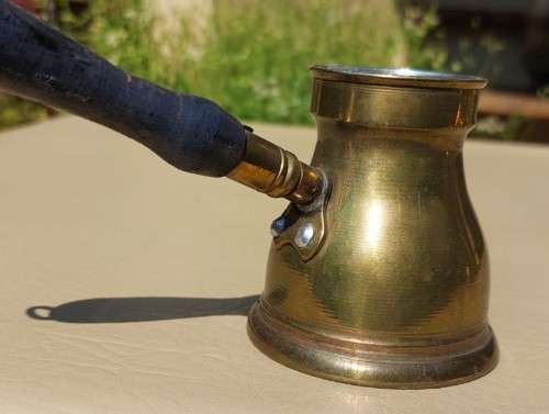 FOUR TURKISH OR GREEK OR ARABIC BRASS COFFEE POTS (CEZVES OR BRIKIS OR JADWHAS)