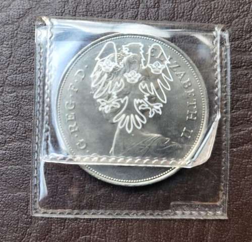 A 1981 ELIZABETH II PRINCE CHARLES AND DIANA SPENCER ROYAL WEDDING 25 NEW PENCE COMMEMORATIVE COIN
