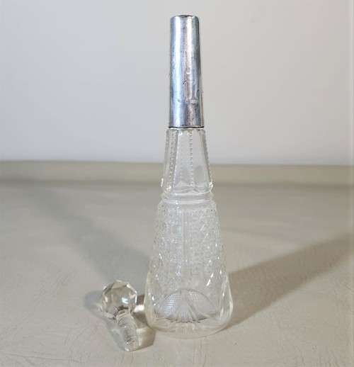 A 1910 DAVID LOEBL SCHINDLER and CO STERLING SILVER COLLAR ON A TALL CYLINDRICAL GLASS SCENT BOTTLE