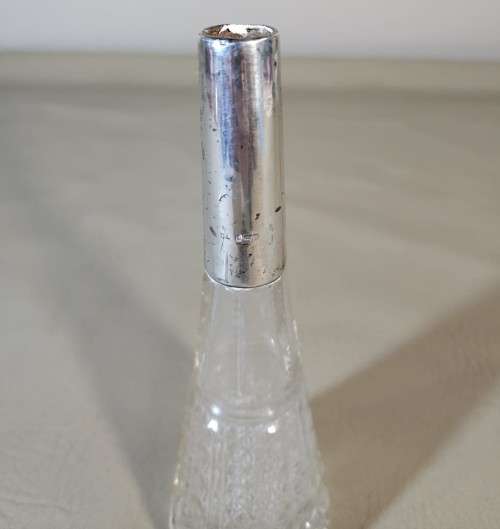 A 1910 DAVID LOEBL SCHINDLER and CO STERLING SILVER COLLAR ON A TALL CYLINDRICAL GLASS SCENT BOTTLE